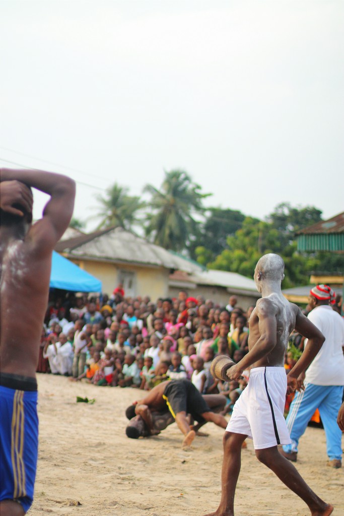 A wrestler throwing another wrestler to the ground, Ete Wrestling Festival, Isiokpo
