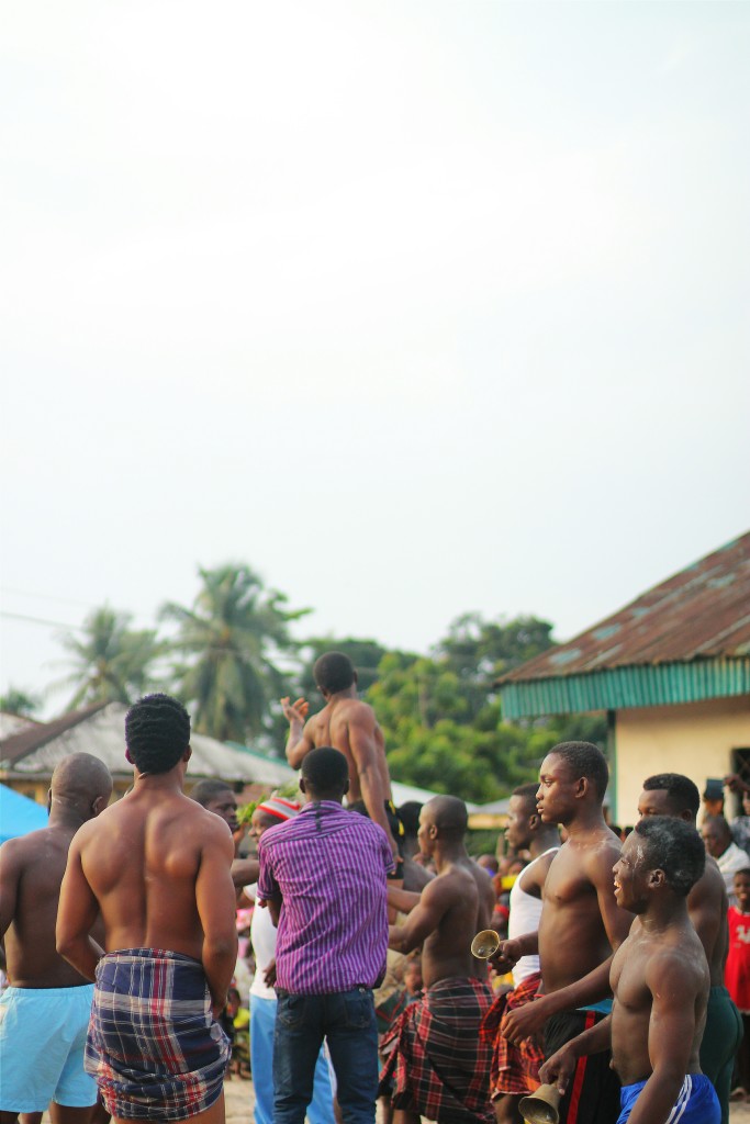 A wrestler being carried by his peers after his victory in a wrestling bout, Ete Wrestling Festival, Isiokpo