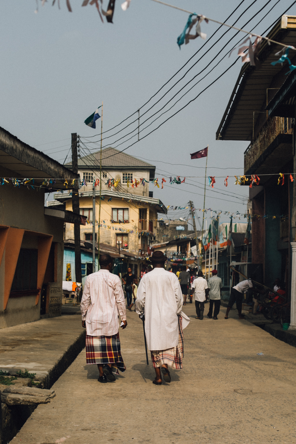 Two men walking in Opobo