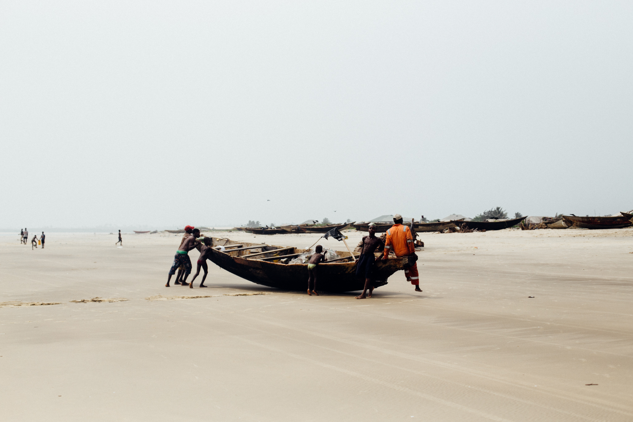 Fishermen bringing the boat home, Ibeno Beach