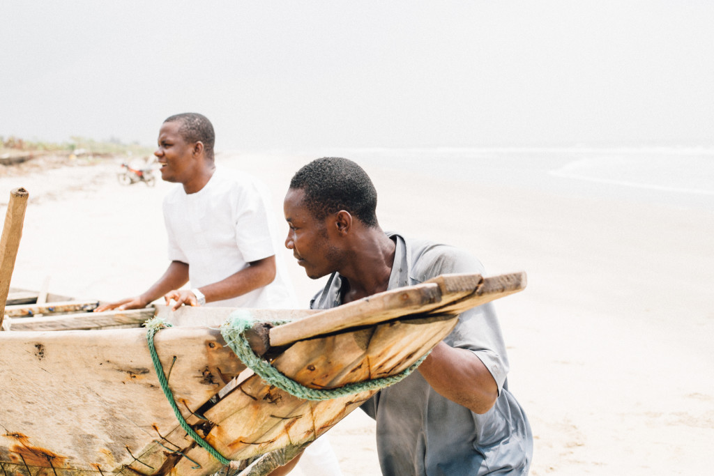 Fishermen bringing the boat home, Ikuru Town Beach